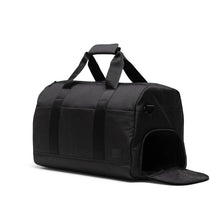 Load image into Gallery viewer, Angled front panel view of the black duffle bag with the side panel shoe compartment opened.