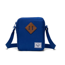 Load image into Gallery viewer, A royal blue Herschel Heritage Crossbody bag with an adjustable strap.