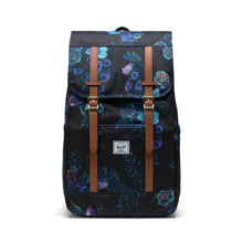 Load image into Gallery viewer, Front view of a black backpack with blue floral print and tan brown straps.