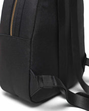 Load image into Gallery viewer, Close up to the shoulder strap on the black mini backpack's back panel.