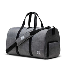 Load image into Gallery viewer, Angled front view of the duffel bag in Raven Crosshatch pattern with an adjustable strap set across.