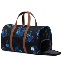 Load image into Gallery viewer, Angled view of the Evening floral bag. The side panel's shoe compartment is unzipped.