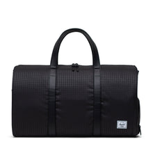 Load image into Gallery viewer, Black houndstooth emboss duffle bag with vegan leather handles on a white background.