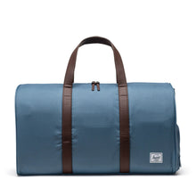 Load image into Gallery viewer, Front view of the Steel Blue duffle bag with brown grab handles.