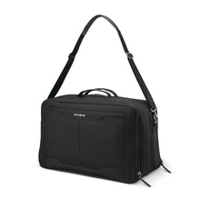 Load image into Gallery viewer, Angled front panel view of the black duffle with the shoulder strap extended.
