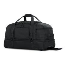 Load image into Gallery viewer, Angled front view of the black duffle bag with the grip handles pulled up. The telescopic handle is pulled partway out.