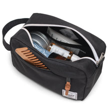 Load image into Gallery viewer, Interior view of the black travel kit filled with cosmetics.