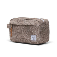 Load image into Gallery viewer, Angled front view of the chapter travel kit in light brown with topography marks.