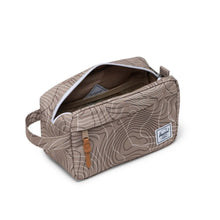 Load image into Gallery viewer, Angled view of the light brown travel kit bag. The main compartment is unzipped.