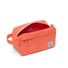 Load image into Gallery viewer, Angled view of the coral floral travel kit with the main compartment unzipped.