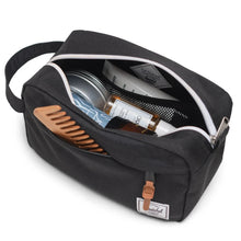 Load image into Gallery viewer, Angled interior view of the Plaid Embossed travel kit bag with cosmetics arranged inside.