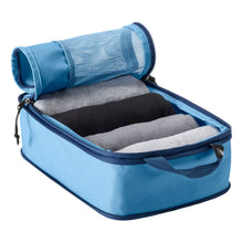 Load image into Gallery viewer, Angled view of the small Blue Dawn compression cube opened and filled with rolled clothes.