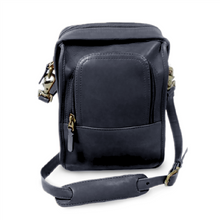 Load image into Gallery viewer, Front view of the black leather crossbody bag. The adjustable shoulder strap is laid at the front.