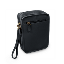 Load image into Gallery viewer, Angled back panel view view of the black leather crossbody bag. The shoulder strap is detached.