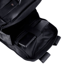 Load image into Gallery viewer, Interior view of the laptop compartment on the black leather backpack. A laptop is secured in the compartment.