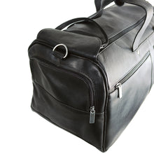 Load image into Gallery viewer, Angled close up to the black duffle bag side panel. It features a zipper-closing pocket.