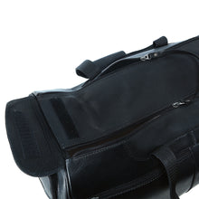 Load image into Gallery viewer, Angled top view of the black leather duffle bag. The main compartment is partway opened.