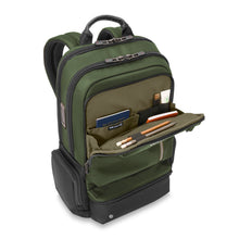 Load image into Gallery viewer, Briggs & Riley HTA Large Cargo Backpack - Hunter
Image of Front Angled View with main front pocket organizer open. Showing RFID shield protected pocket to protect against identity theft. Elastic pockets for cables, pens, pencils, smart phone, etc.
Dimensions: 18.5" x 14" x 8"
Weight: 2.5 lbs.