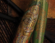 Load image into Gallery viewer, Close up to the cap and barrel. The cap features the faces of the couple: The man plays the flute while his wife hangs on to him. They are decorated with jewelry and traditional attire. The barrel features the illustration of a tree painted in gold urushi lacquer.