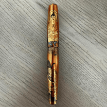 Load image into Gallery viewer, Front view of the fountain pen on a wooden background.