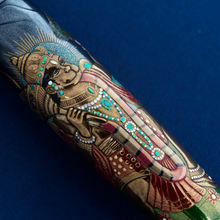 Load image into Gallery viewer, Close up to The Hanuman painted on the barrel. Placed on a blue background.