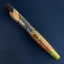 Load image into Gallery viewer, Set on a blue background: The front of Fountain Pen with the cap placed on.