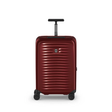 Load image into Gallery viewer, Front panel view of the red suitcase with the telescopic handle partly extended.