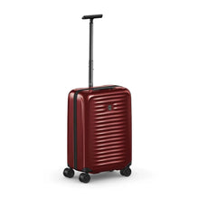 Load image into Gallery viewer, Angled front panel view of the red suitcase with the telescopic handle extended.