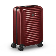 Load image into Gallery viewer, Angled front panel view of the red suitcase.