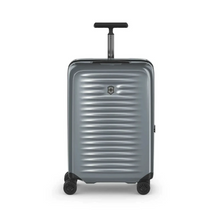 Load image into Gallery viewer, Angled front panel view of the silver suitcase with the telescopic handle partly extended.