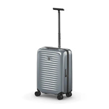 Load image into Gallery viewer, Angled front panel view of the silver suitcase with the telescopic handle extended.
