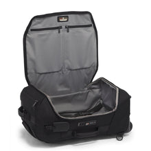 Load image into Gallery viewer, Interior view of the suitcase. It has a light gray lining, two zipper-closing pockets on the lid for organization, and a set of adjustable straps to hold contents in place.