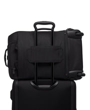 Load image into Gallery viewer, Back panel view showing the attachment strap. it allows for the handle of a trolley or wheeled suitcase to slide through and hold it in place.