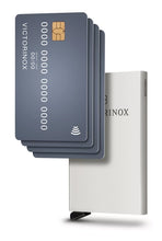 Load image into Gallery viewer, Angled front panel view of the card case with four credit cards placed in front of it.