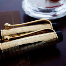 Load image into Gallery viewer, Close up to the side of the writing instruments. An engraving on each reads "Aurora N. 0609"