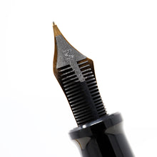 Load image into Gallery viewer, Close up to the Fountain Pen feed on a white background. It is black and has an engraved M, for Medium.