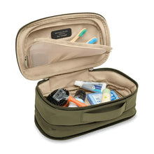 Load image into Gallery viewer, Briggs & Riley Baseline Expandable Essentials Kit - Olive
Image of Spacious Interior shown with top lid unzipped.  As well as larger toiletries packed in main compartment.
Height	Width	Depth	Weight
US	6 in.	11 in.	4.5 in.	.8 lbs.
EU	15.2 cm	27.9 cm	11.4 cm	0.4 kg