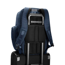 Load image into Gallery viewer, Briggs & Riley Baseline Traveler Backpack - Navy
Image of Attachment Feature allowing this Backpack to ride along the telescoping handles of your carry-on trolley bag.
Height Width Depth Weight
US 18 in. 12 in. 8.8 in. 3.3 lbs.
EU 45.7 cm 30.5 cm 22.4 cm 1.5 kg