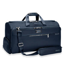 Load image into Gallery viewer, Briggs & Riley Baseline Garment Duffle - Navy
Image of Front Angled view shown with matching shoulder strap
Height	Width	Depth	Weight
US	12.5 in.	22 in.	9 in.	4.2 lbs.
EU	31.8 cm	55.9 cm	22.9 cm	2 kg