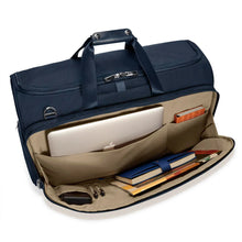 Load image into Gallery viewer, Briggs & Riley Baseline Garment Duffle - Navy
Image of Front Panel Business organizer, with space for your laptop, smart phone, cables, pens, and business essentials.
Height	Width	Depth	Weight
US	12.5 in.	22 in.	9 in.	4.2 lbs.
EU	31.8 cm	55.9 cm	22.9 cm	2 kg