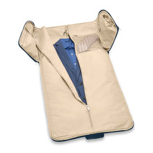 Load image into Gallery viewer, Briggs & Riley Baseline Garment Bag Duffle - Navy
Image of Interior Garment Suiter zipped open to demonstrate how the garments hang
Height	Width	Depth	Weight
US	12.5 in.	22 in.	9 in.	4.2 lbs.
EU	31.8 cm	55.9 cm	22.9 cm	2 kg