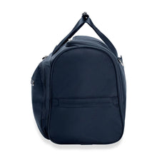 Load image into Gallery viewer, Briggs & Riley Baseline Garment Bag Duffle - Navy
Image of Side Panel View
Height	Width	Depth	Weight
US	12.5 in.	22 in.	9 in.	4.2 lbs.
EU	31.8 cm	55.9 cm	22.9 cm	2 kg