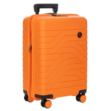Load image into Gallery viewer, Angled front view of the 21 inch carry-on orange suitcase on a white background. It has black accents, and features a design of lines on the front and back.