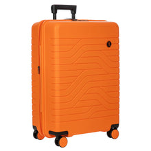 Load image into Gallery viewer, Angled view of the 28 inch orange suitcase. Set on a white background. The suitcase is orange with black accents, and features a design of lines on the front and back.