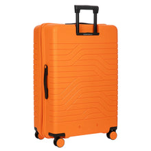 Load image into Gallery viewer, Angled back view of the orange expandable spinner suitcase. Set on a white background.