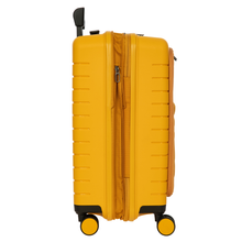 Load image into Gallery viewer, Side view of the mango-yellow carry-on suitcase on a white background. The expandable feature is opened.