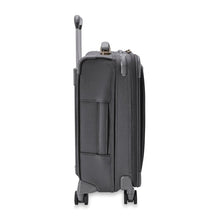 Load image into Gallery viewer, Side view of the suitcase with the telescopic handle partly pulled.