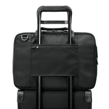 Load image into Gallery viewer, Briggs & Riley HTA Slim Expandable Brief - Black
Image of Back Panel Attachment Feature.  Showing this brief attached to telescoping handle of trolley carry-on bag.
Height	Width	Depth	Weight
US	15.75"	11"	6"	2.55 lbs.
EU	40 cm	27.9 cm	15.24 cm	1.16 kg