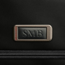 Load image into Gallery viewer, Briggs & Riley HTA Slim Expandable Brief - Black
Image of Leather Monogram Patch.  Room to emboss up to 3 block style initials.
Height	Width	Depth	Weight
US	15.75"	11"	6"	2.55 lbs.
EU	40 cm	27.9 cm	15.24 cm	1.16 kg
