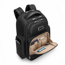Load image into Gallery viewer, Angled panel view of the black backpack with the front pocket unzipped.